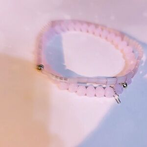 Set of 2 Pale Pink Bracelets. One has micro .925 silver cross